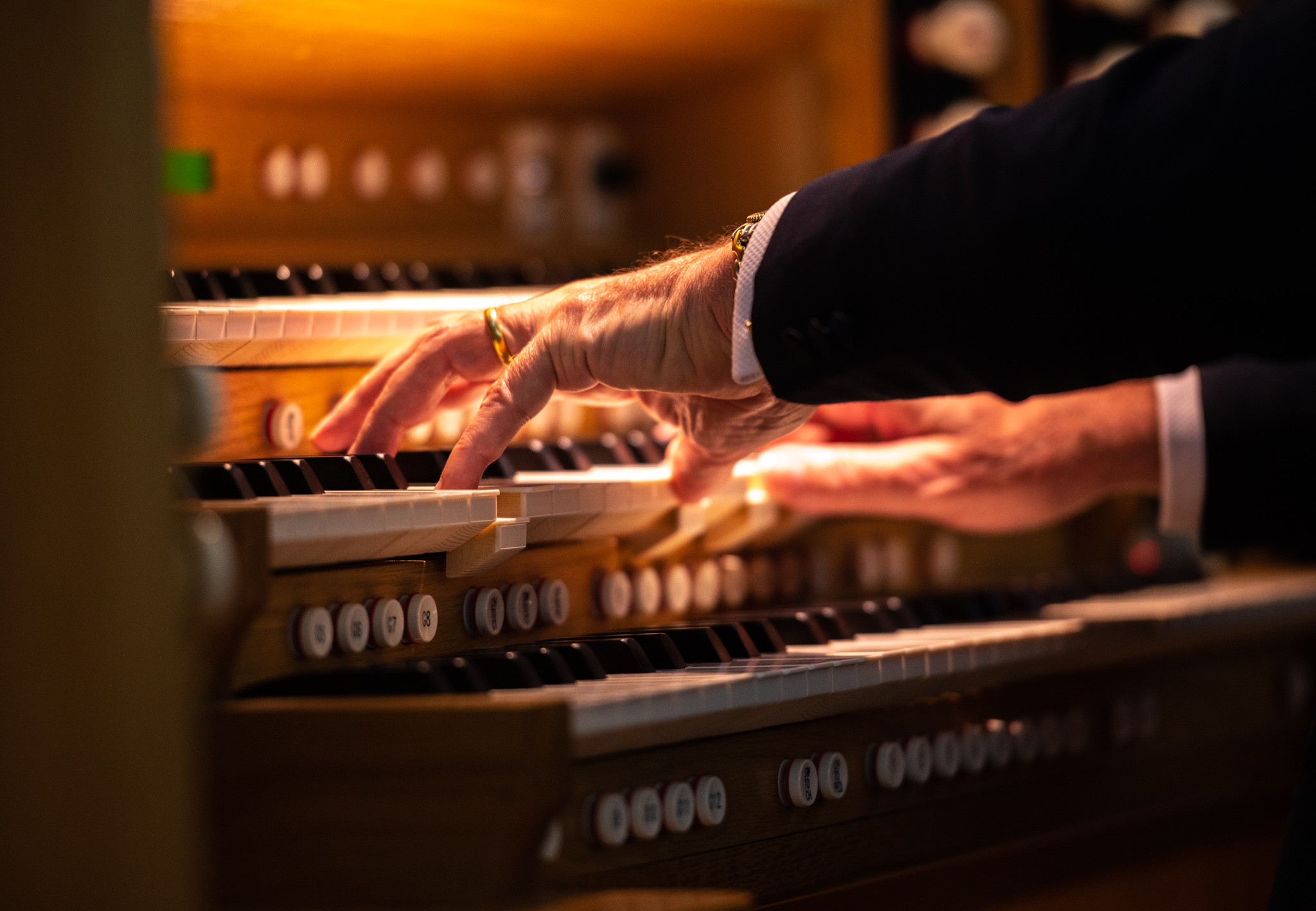A musician playing the organ during a Dubai Singers performance