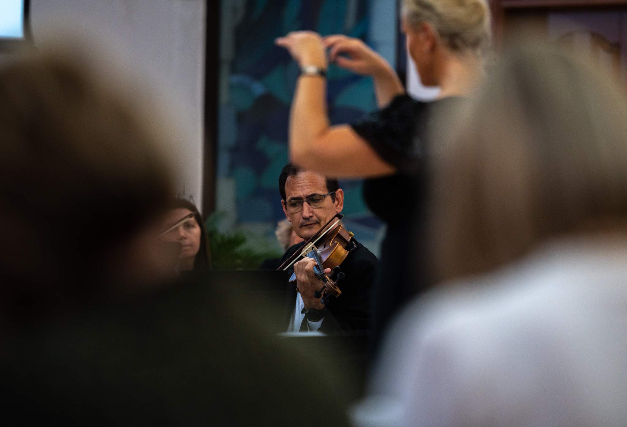 A violinist performing with Dubai Singers